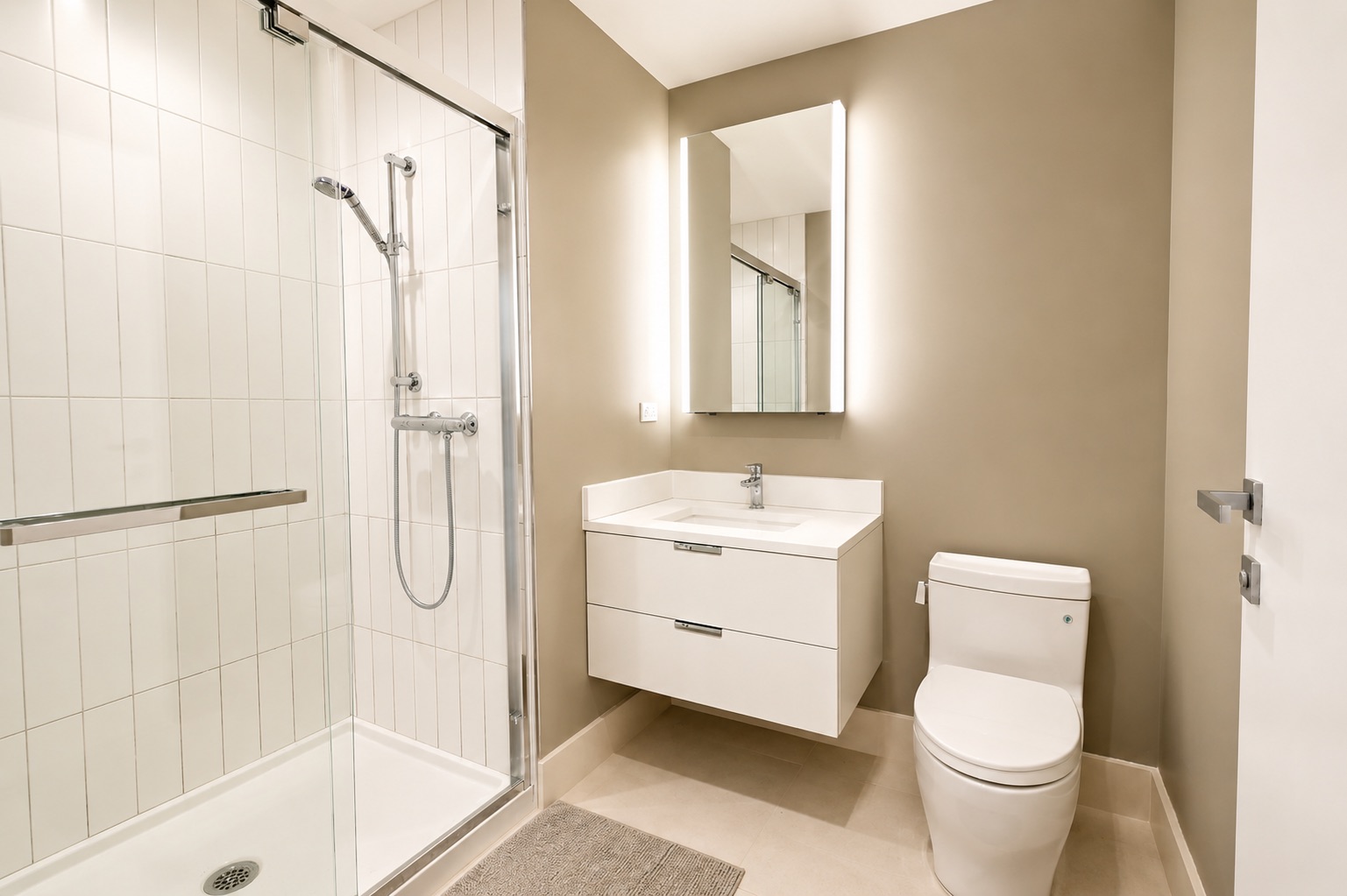 Renovated bathroom with walk-in glass shower